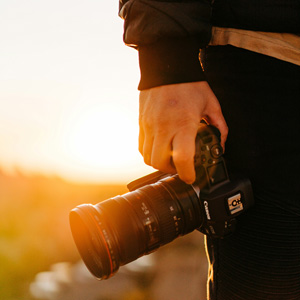 Person holding a camera in the Ngorongoro Crater