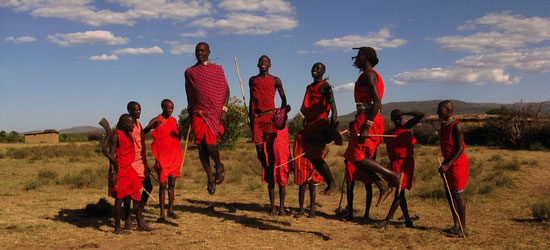 Jumping warriors of a Maasai tribe in traditional red robes