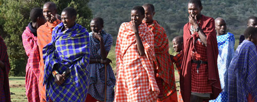 Maasai warriors in Tanzania in traditional colorful, checkered clothing